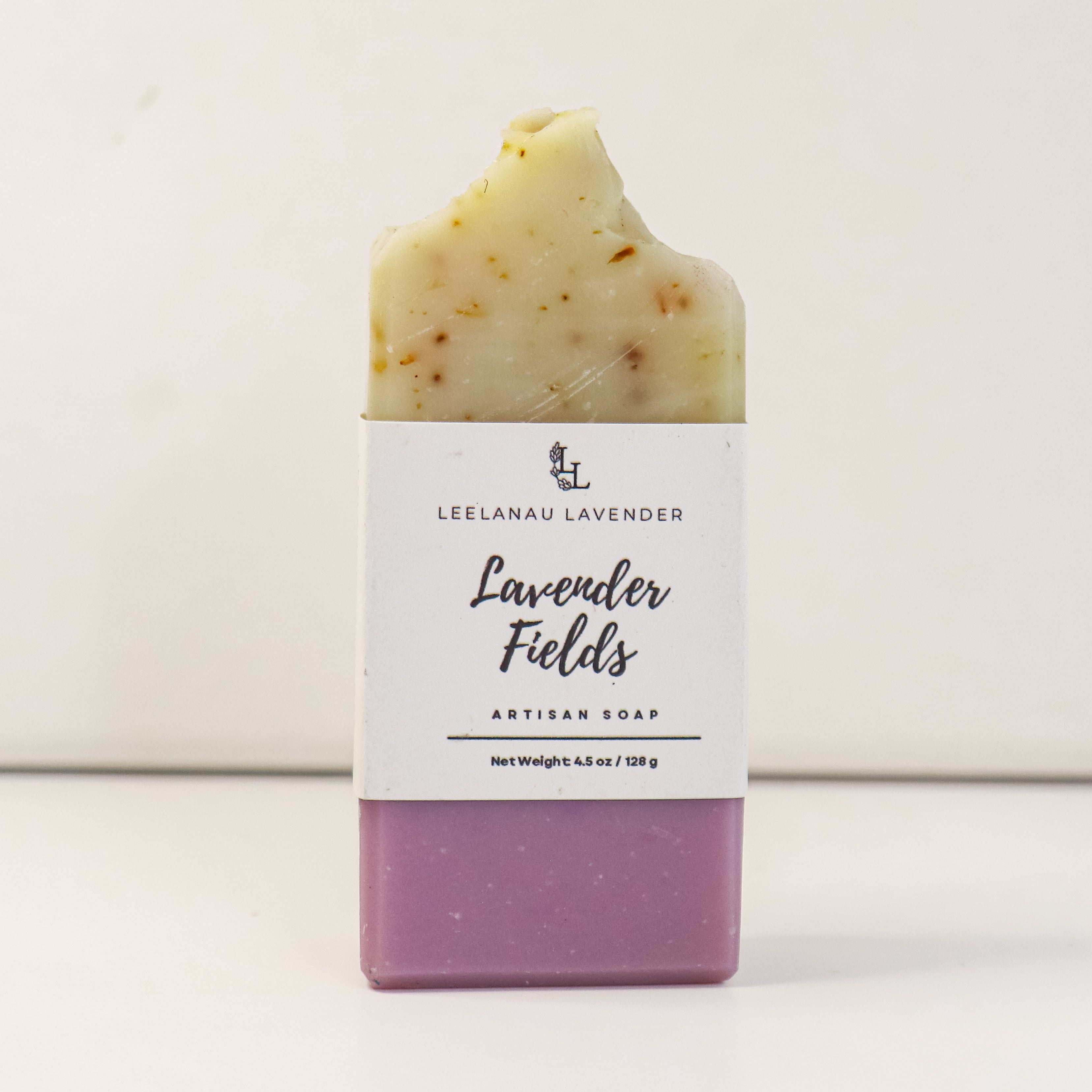 Bar of soap with a white label on a light background