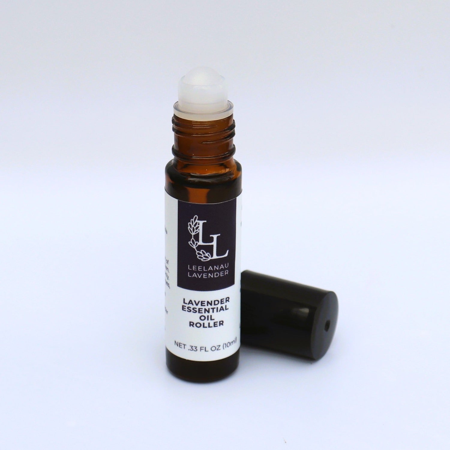A small roll-on bottle of lavender essential oil