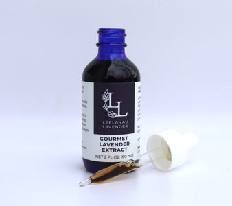 Lavender Extract bottle with dropper filled with brown extract next to it